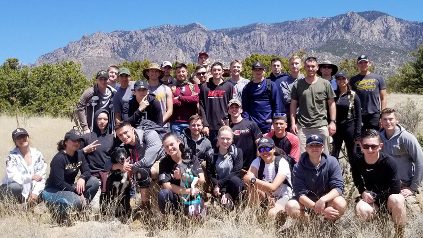Group shot of Army ROTC in front of Sandia Mountains
